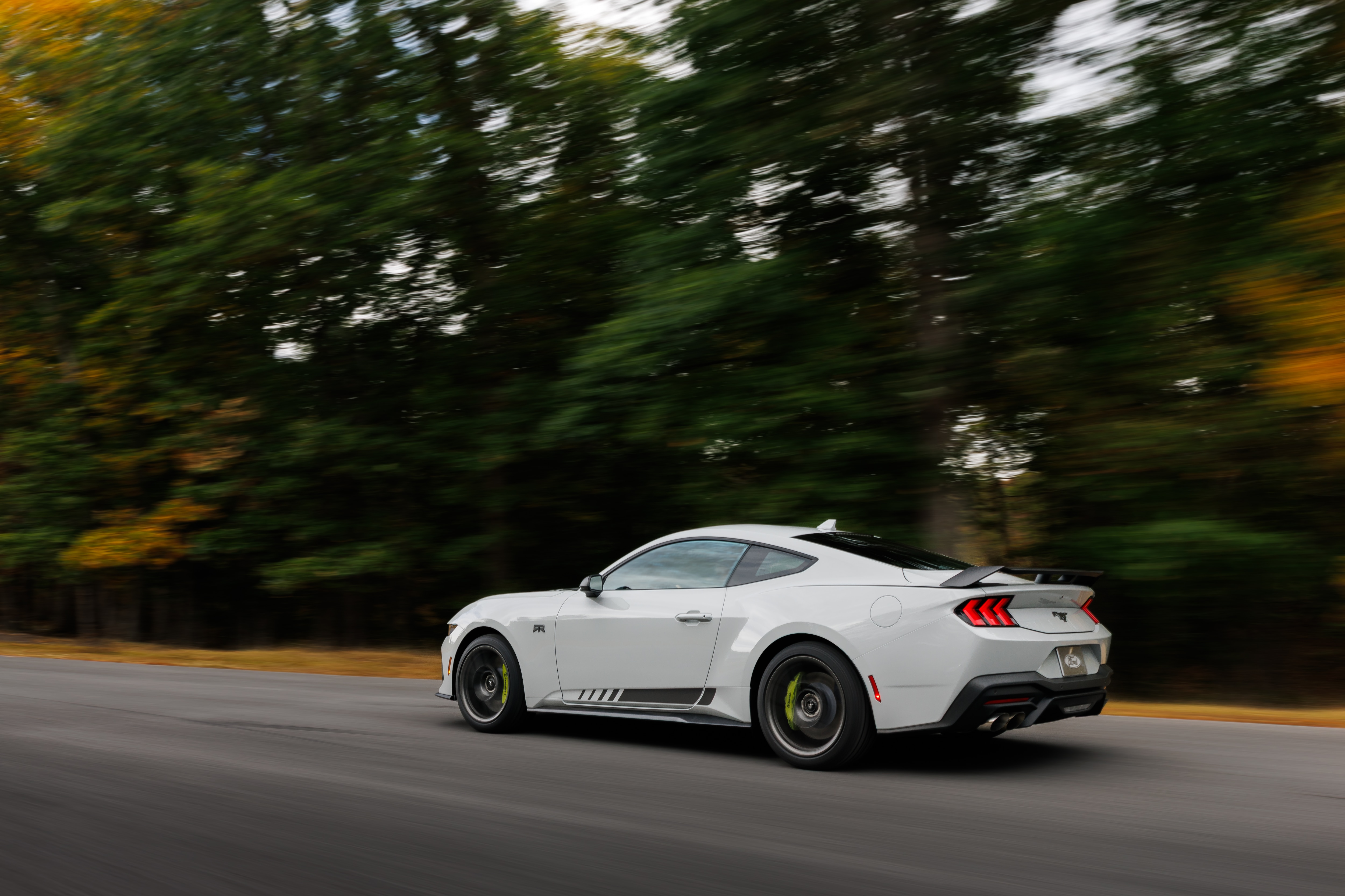 Optional RTR package available on 2026 Ford Mustang EcoBoost fastback. Preproduction model shown with optional Hyper Lime brake caliper shown. Available late spring 2026.